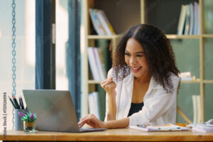 A triumphant medical student smiling after meeting her Qmax goals for the day